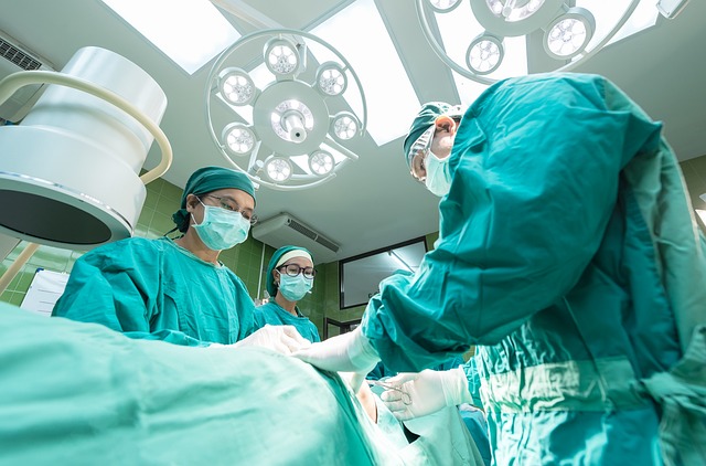 *Health Savings Account*—Surgeons performing an operation under bright surgical lights in an operating room, symbolizing medical expenses, healthcare funding, and financial planning for health-related costs.