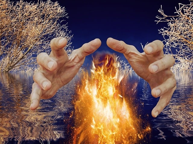 a hands reaching out over water