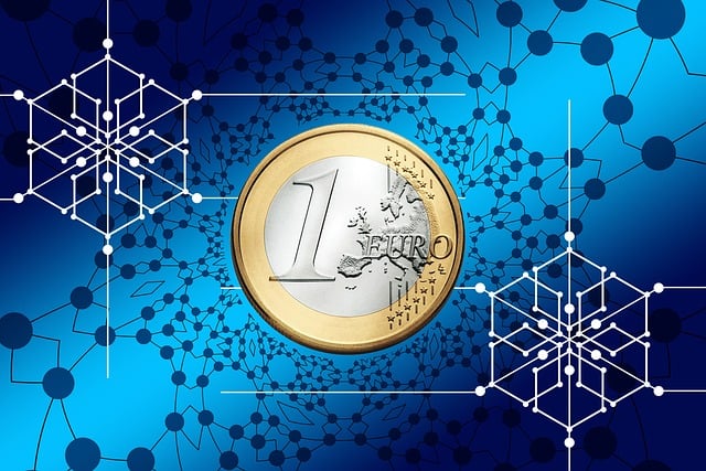 a coin with a gold and silver coin with a blue background