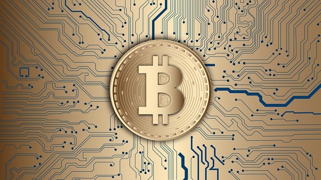*Tax on Blockchain*—A gold-colored Bitcoin symbol stands prominently in the center, surrounded by a detailed circuit board pattern. The intricate background represents the digital infrastructure and technological aspects of cryptocurrency and blockchain.
