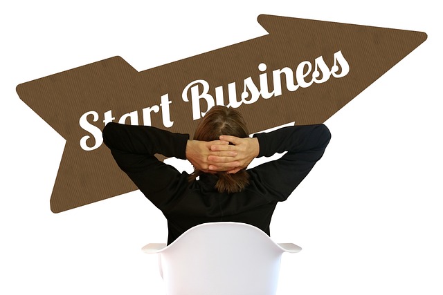 A person seated in a white chair, facing a bold **Start Business** arrow sign, symbolizing ambition and financial opportunities. A visual representation of **How to Invest in a Startup** and the journey toward entrepreneurship.