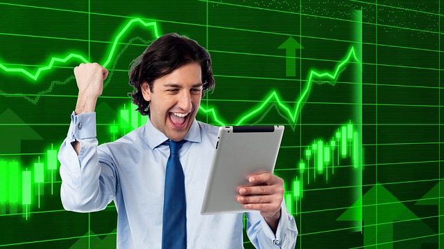 A person in a business suit holding a tablet, with financial graphs in the background, symbolizing **Financial Trends Analysis** and market growth.