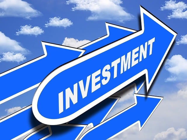Several blue arrows pointing upwards against a sky with white clouds, with the word **Investment** prominently displayed, symbolizing **Personal Investment Portfolio** and financial growth.