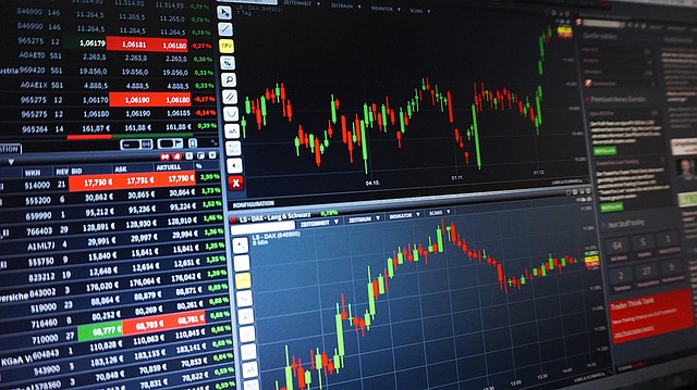 *Stock Market News and Analysis*—A dynamic stock trading interface displaying candlestick charts, real-time price movements, trading volumes, and financial data, symbolizing in-depth market research and analysis.