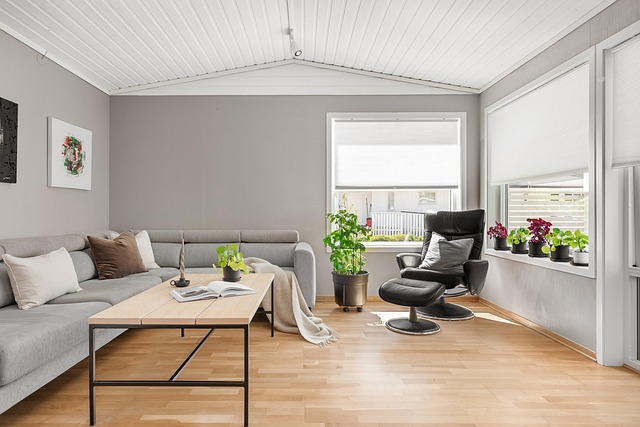 "Modern, sunlit living room with stylish furniture and indoor plants, representing an ideal property to invest $100K in real estate."